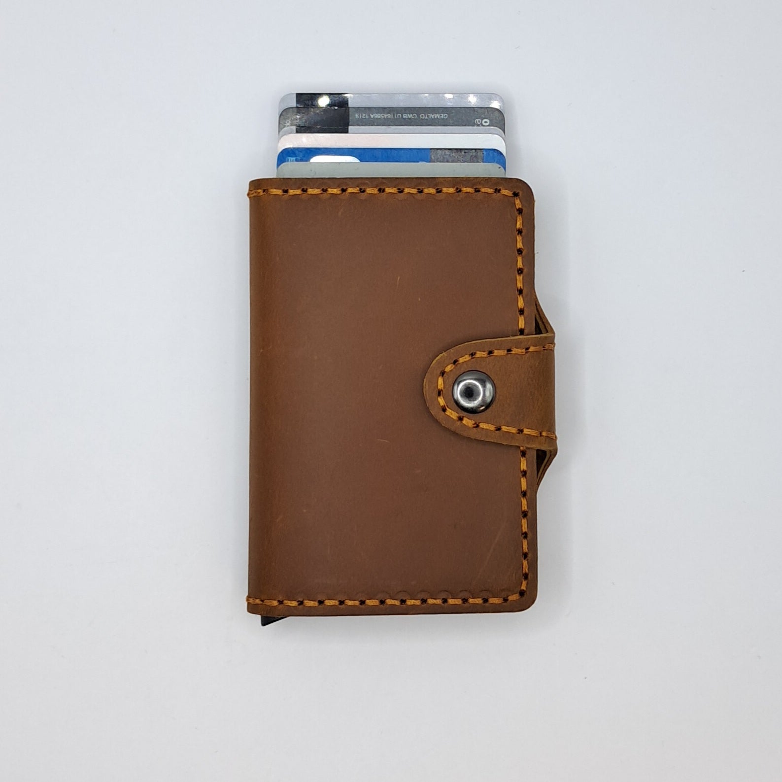 Billetera de cuero genuino, estilo tarjetero de doble hoja con broche.