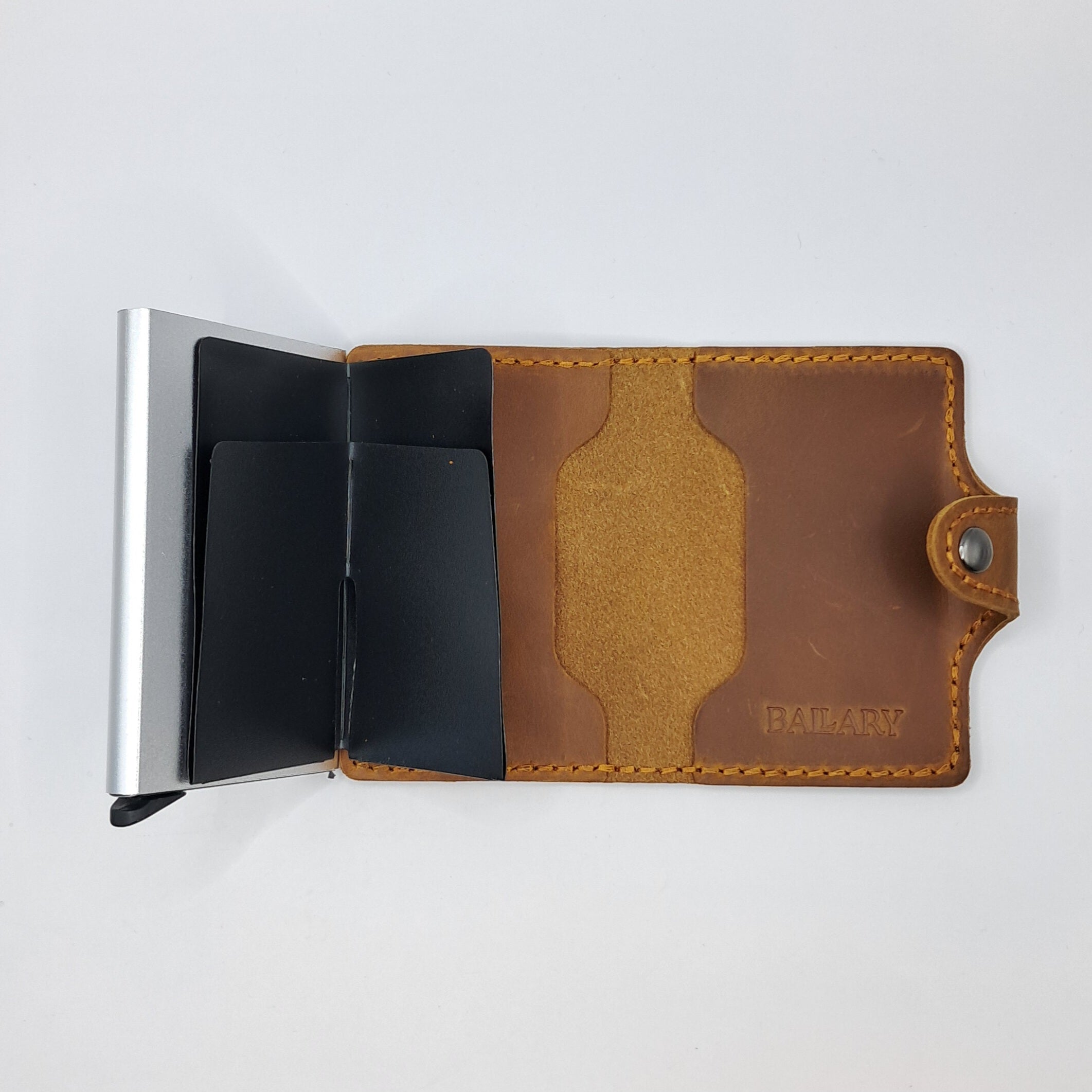 Billetera de cuero genuino, estilo tarjetero de doble hoja con broche.